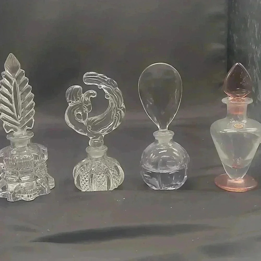 Small collection of Art Deco era perfume bottles.
